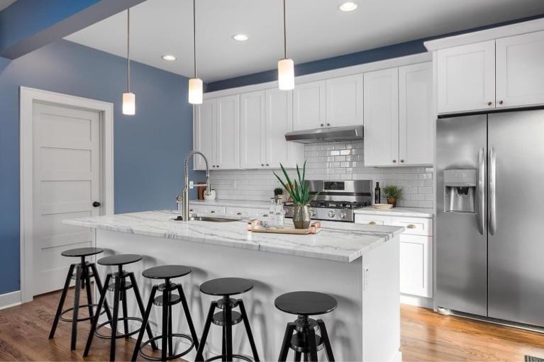 Beautiful kitchen designed by expert ProCabinets design team featuring The Pro Collection ProWhite Shaker