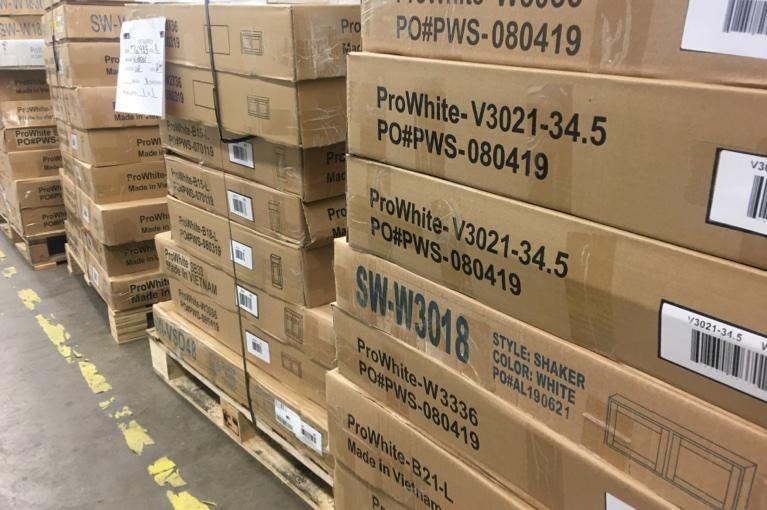 Boxed ProWhite cabinets in warehouse